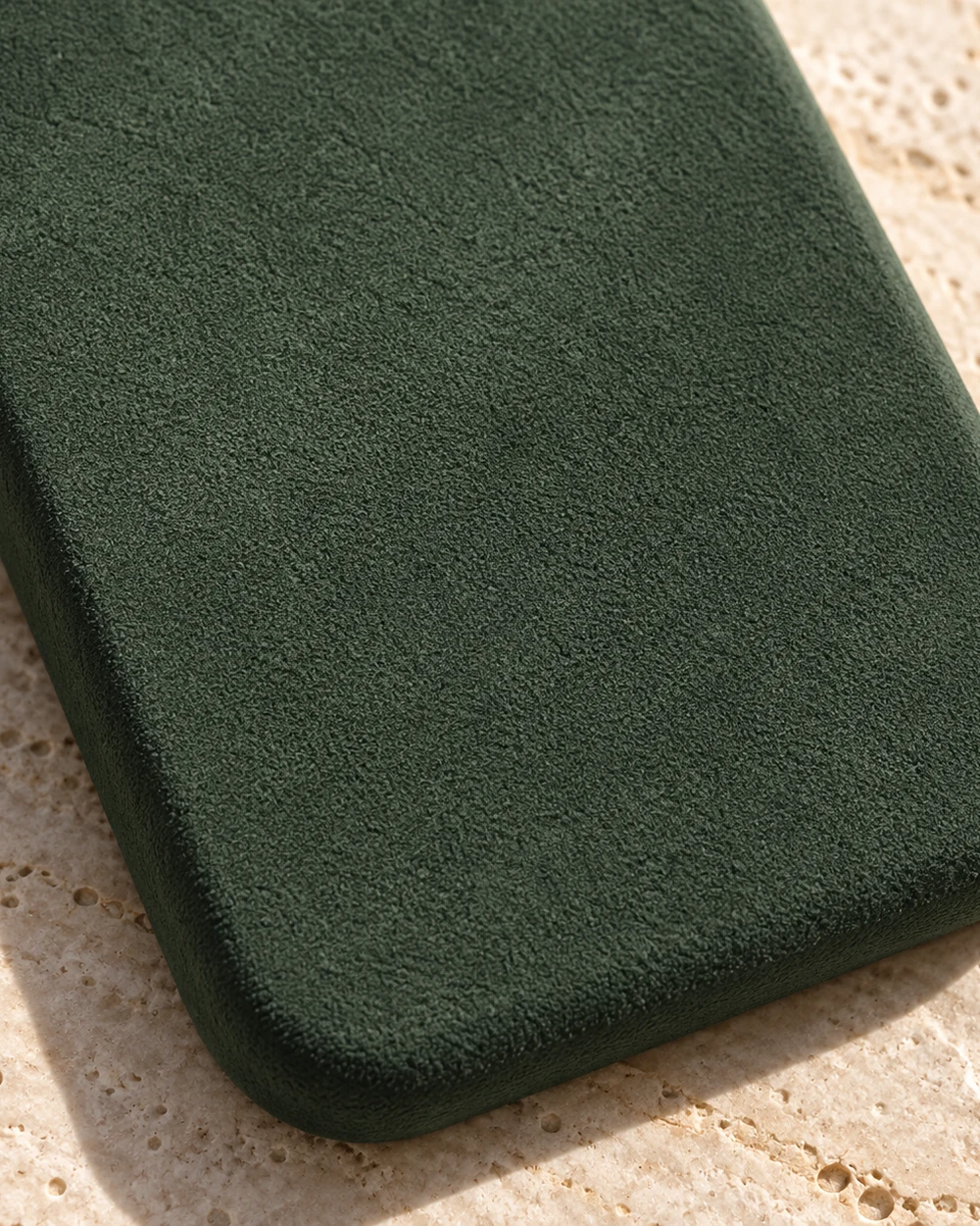 Close-up of the green suede-feel finish